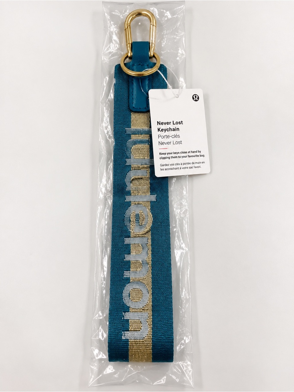 NWT lululemon Never Lost Keychain Wordmark Warp Teal Gold Bone